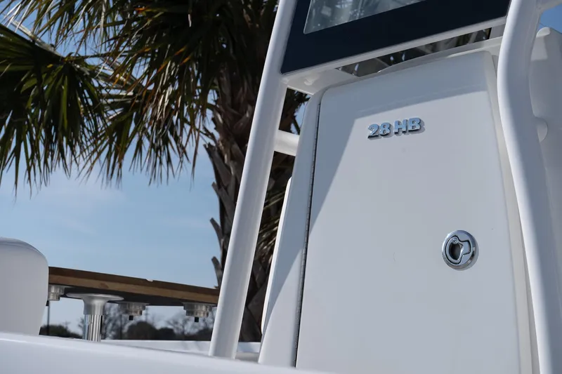 Slide: The Image of 2026 Caymas 28 HB boat detail with palm tree background. - 7