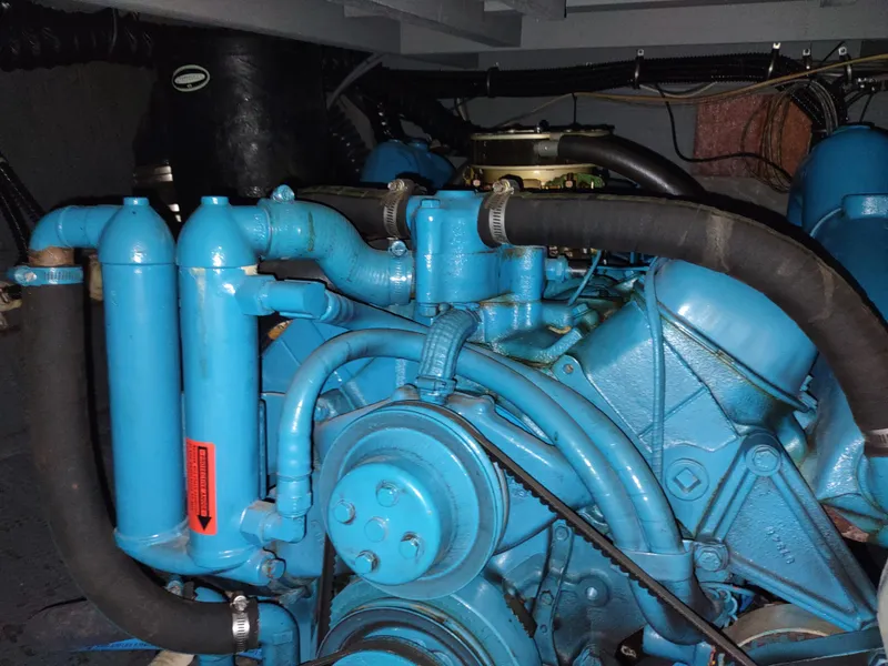 Slide: The Image of Engine room of 1987 Chris-Craft 381 Catalina with blue engine. - 30