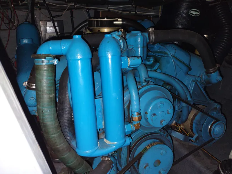 Slide: The Image of Engine of a 1987 Chris-Craft 381 Catalina boat, painted blue. - 33