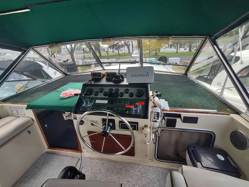Slide: The Image of Interior view of 1987 Chris-Craft 381 Catalina cockpit with Garmin navigation. - 8