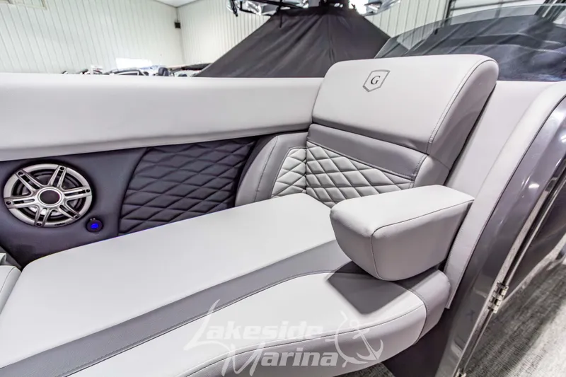 Slide: The Image of Luxurious seating on 2026 Godfrey Monaco 255 MTF boat with speaker and quilted design. - 15