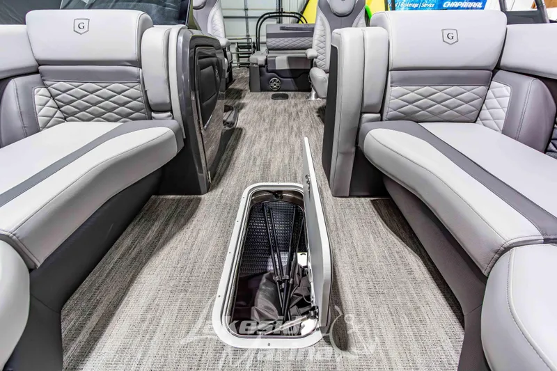 Slide: The Image of 2026 Godfrey Monaco 255 MTF interior with luxurious seating and storage compartment. - 17