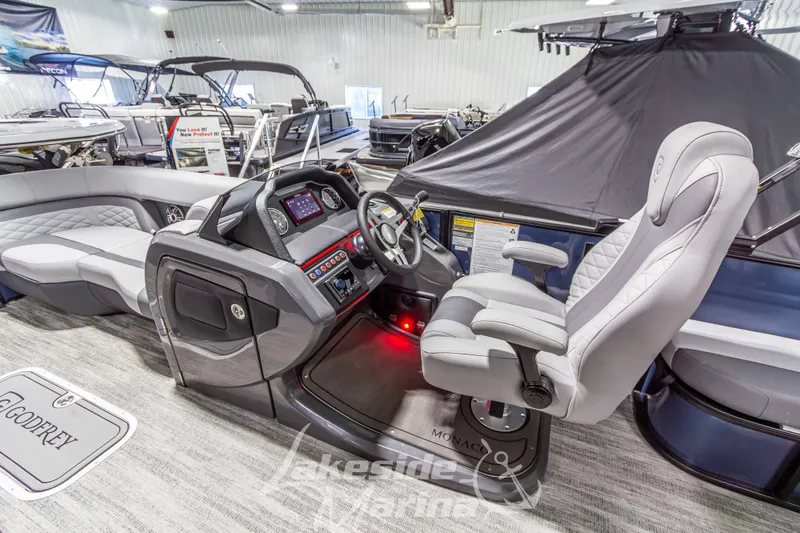 Slide: The Image of 2026 Godfrey Monaco 255 MTF boat interior with modern helm and seating. - 19