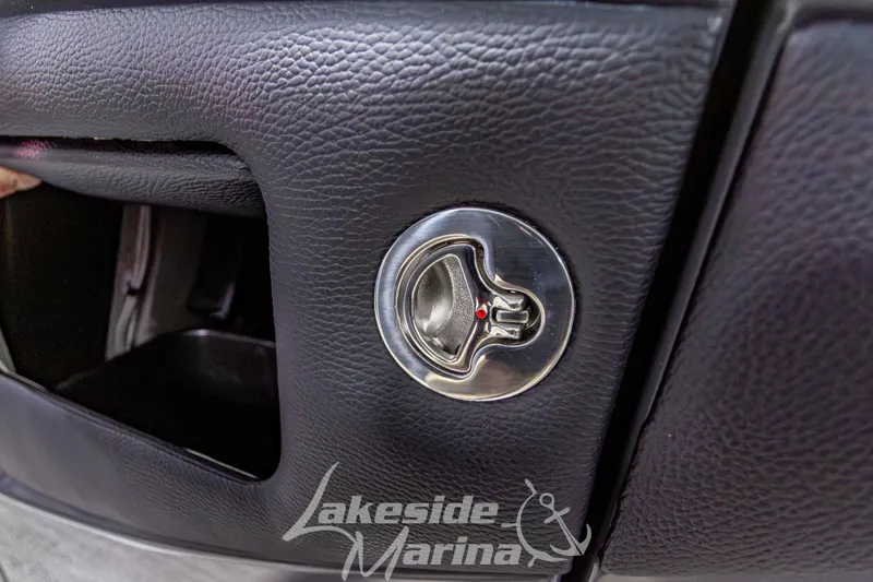 Slide: The Image of Close-up of a 2026 Godfrey Monaco 255 MTF boat's sleek black leather interior detail. - 21