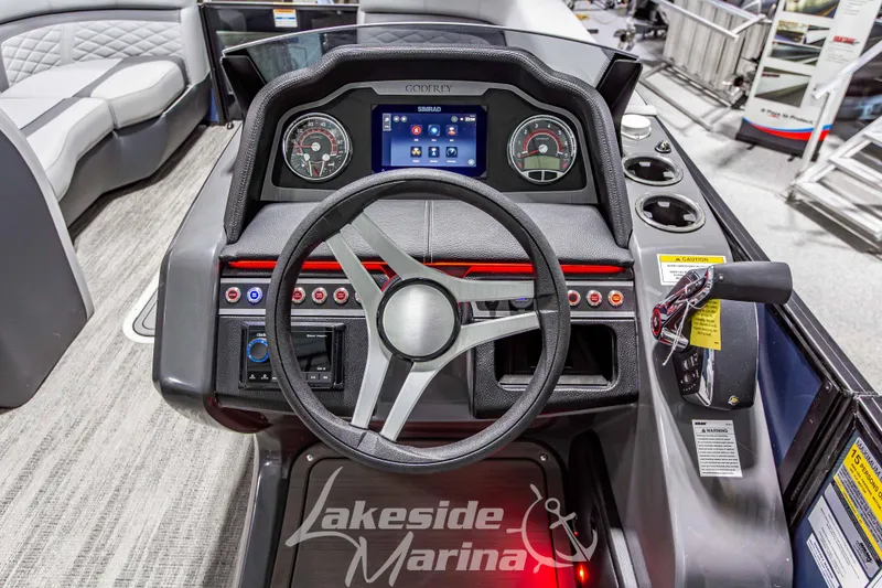Slide: The Image of Steering console of 2026 Godfrey Monaco 255 MTF boat with modern controls and dashboard. - 22