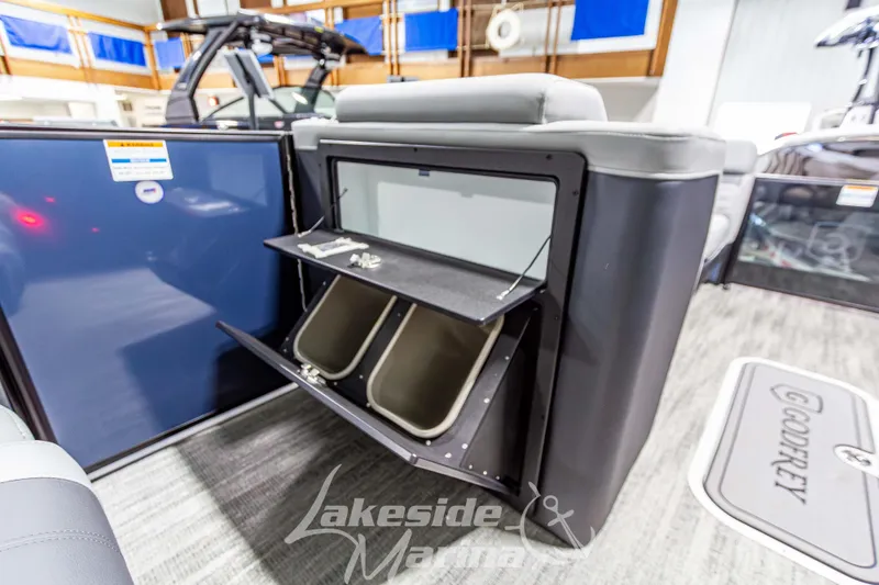 Slide: The Image of 2026 Godfrey Monaco 255 MTF boat interior with storage compartments open. - 27
