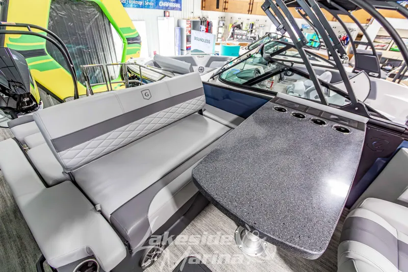 Slide: The Image of Luxurious interior of 2026 Godfrey Monaco 255 MTF pontoon boat with sleek seating and table. - 31