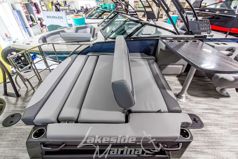 Slide: The Image of 2026 Godfrey Monaco 255 MTF pontoon boat interior with seating and table at Lakeside Marina. - 35