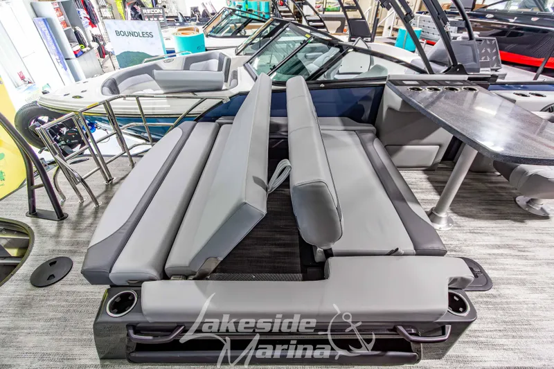 Slide: The Image of 2026 Godfrey Monaco 255 MTF boat interior with gray seating and table at Lakeside Marina. - 37