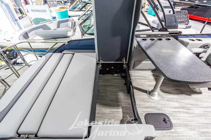 Slide: The Image of Interior of 2026 Godfrey Monaco 255 MTF boat with seating and table setup. - 40