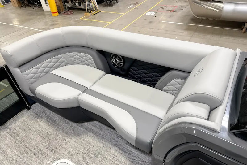 Slide: The Image of 2026 Godfrey Monaco 255 MTF pontoon boat with Mercury outboard engine in showroom. - 5