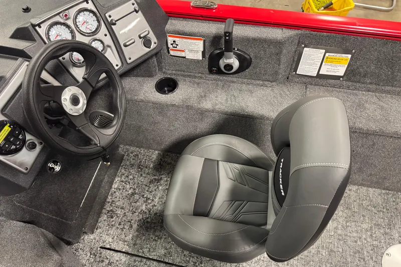Slide: The Image of 2026 Tracker Pro Guide V-175 WT boat interior with steering wheel and seat. - 11