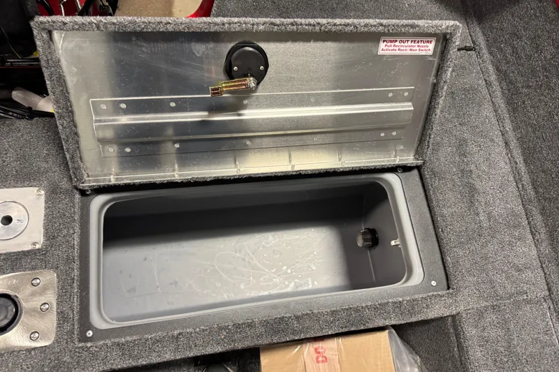 Slide: The Image of Open storage compartment in 2026 Tracker Pro Guide V-175 WT boat, featuring pump-out feature. - 15