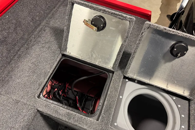 Slide: The Image of Open storage compartments in 2026 Tracker Pro Guide V-175 WT boat, showing wiring and interior details. - 17