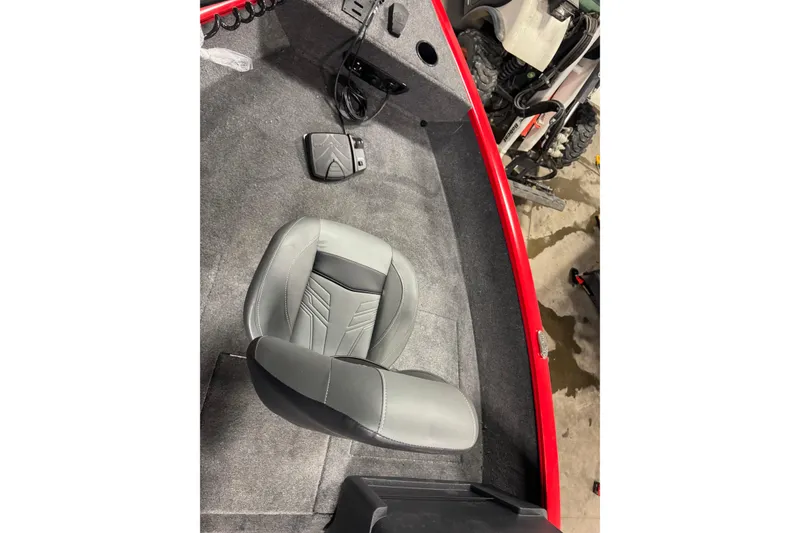 Slide: The Image of Interior of 2026 Tracker Pro Guide V-175 WT boat with gray seating and red trim. - 19