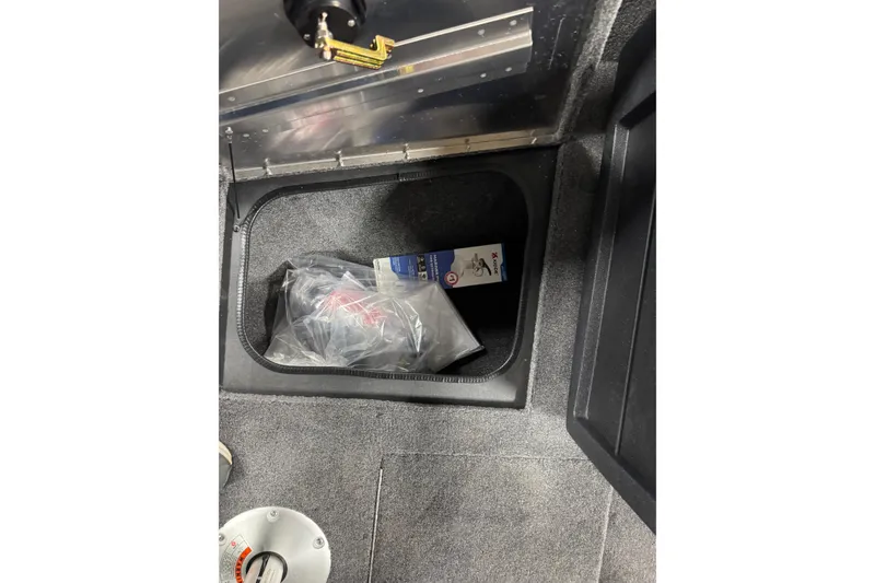 Slide: The Image of Storage compartment in 2026 Tracker Pro Guide V-175 WT boat interior. - 21