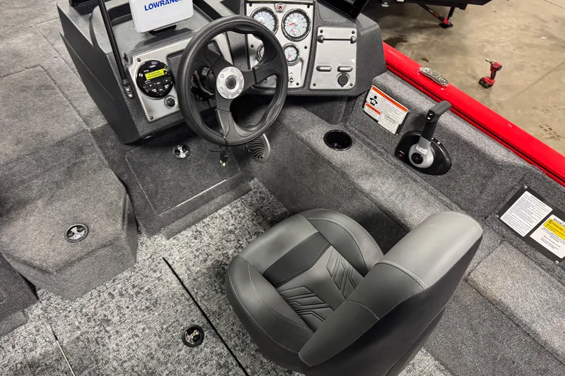 Slide: The Image of 2026 Tracker Pro Guide V-175 WT boat interior with steering wheel and control panel. - 7