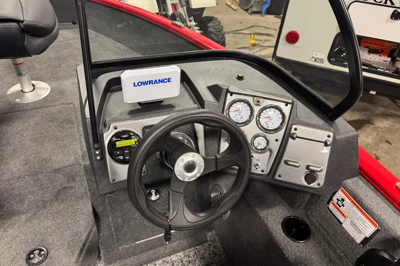 Slide: The Image of 2026 Tracker Pro Guide V-175 WT boat dashboard with steering wheel and Lowrance display. - 9