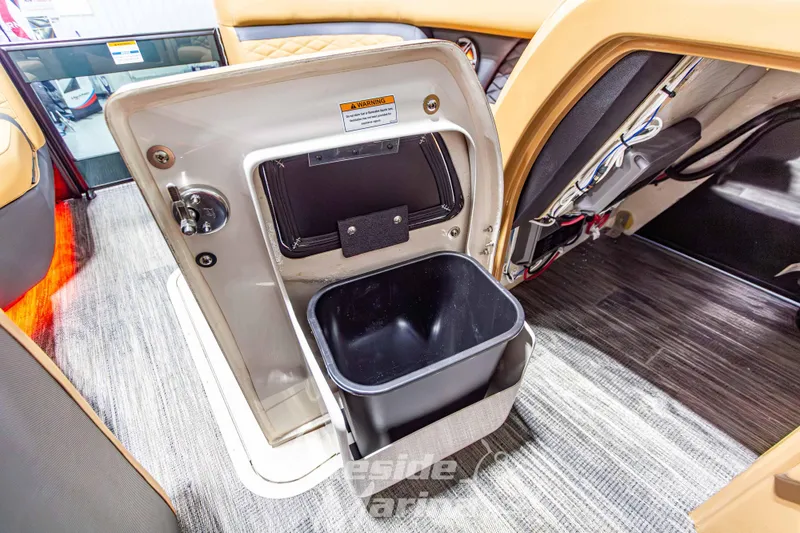 Slide: The Image of Interior of 2026 Godfrey Monaco 255 MTF showing storage compartment and trash bin. - 22