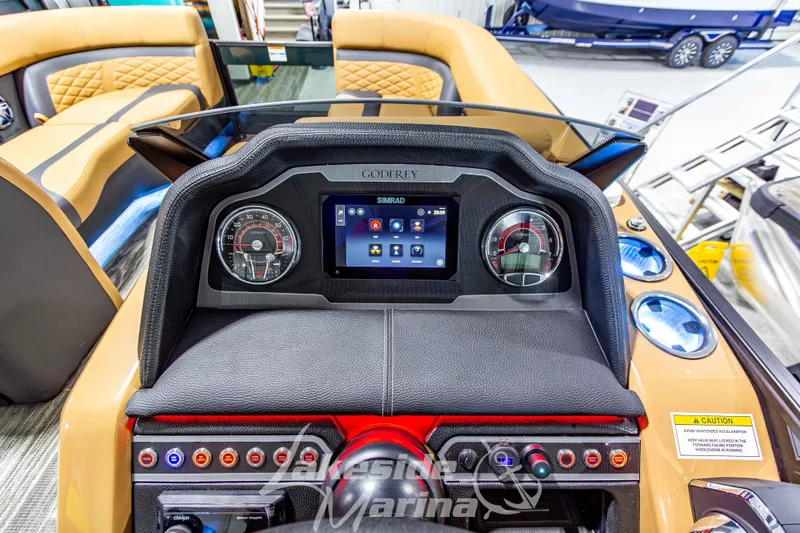 Slide: The Image of Dashboard of 2026 Godfrey Monaco 255 MTF boat with digital display and controls. - 24