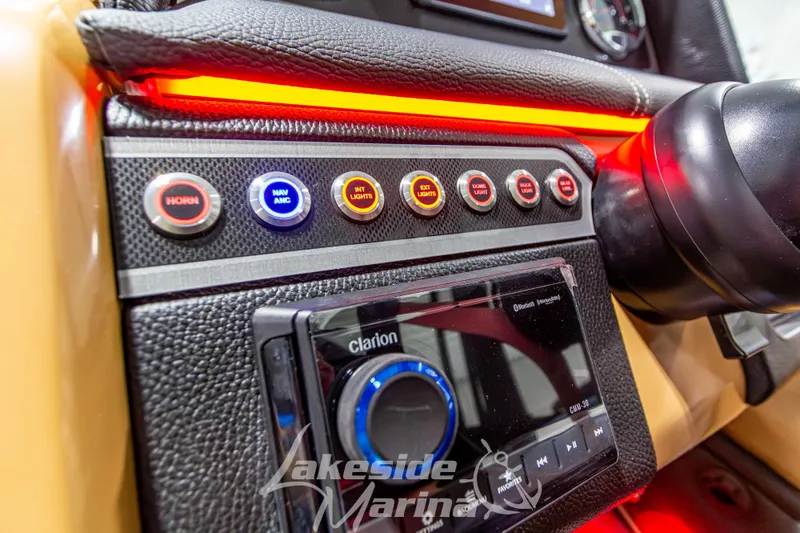 Slide: The Image of 2026 Godfrey Monaco 255 MTF dashboard with control buttons and Clarion audio system. - 25