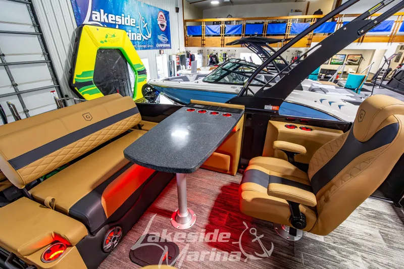 Slide: The Image of Luxurious interior of 2026 Godfrey Monaco 255 MTF boat at Lakeside Marina showroom. - 26