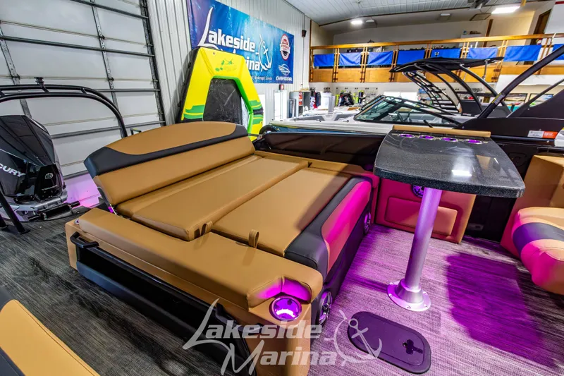 Slide: The Image of 2026 Godfrey Monaco 255 MTF boat interior with luxurious seating and table at Lakeside Marina. - 40