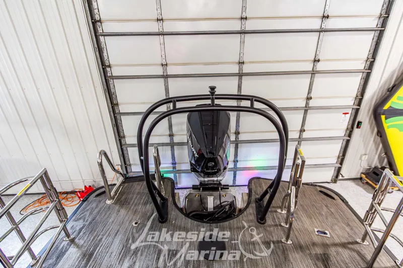 Slide: The Image of 2026 Godfrey Monaco 255 MTF boat engine in a marina garage setting. - 42