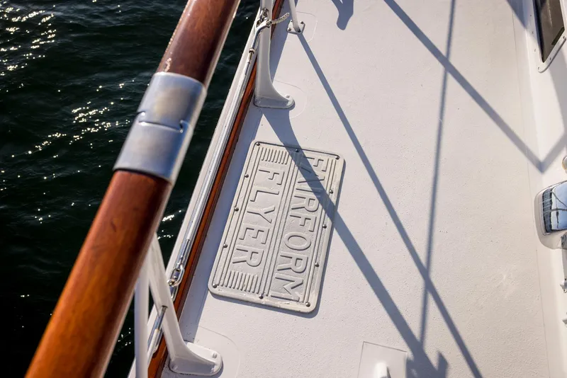 Slide: The Image of Deck of 1964 Huckins Out Islander 56 yacht with "Fairform Flyer" plaque. - 17