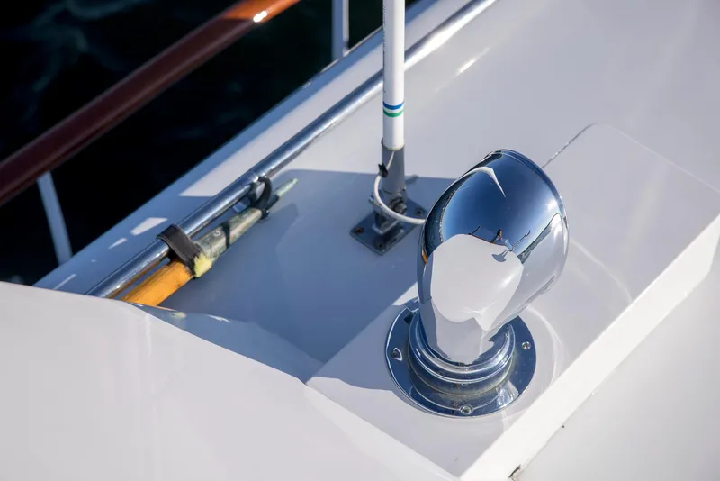 Slide: The Image of 1964 Huckins Out Islander 56 yacht deck detail with chrome vent and railing. - 18