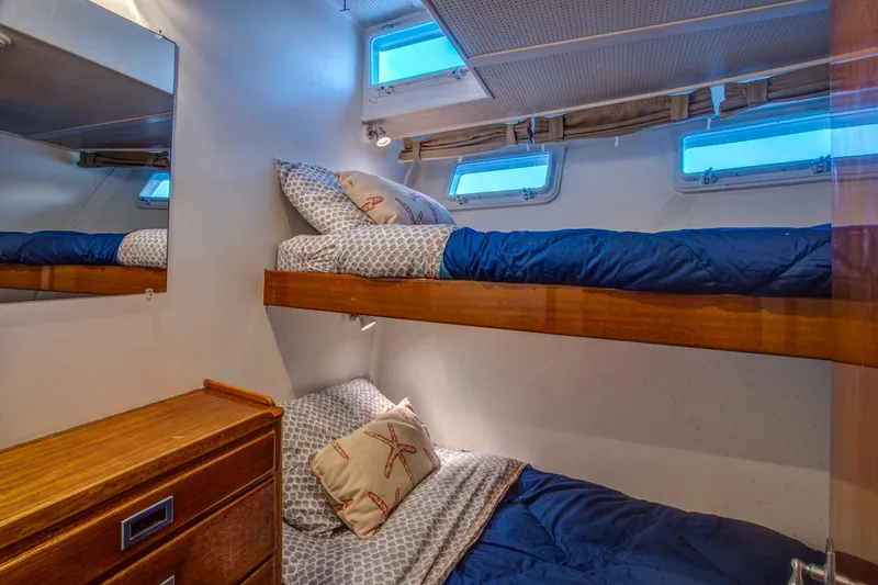 Slide: The Image of Bunk beds in 1964 Huckins Out Islander 56 yacht cabin with nautical decor. - 43