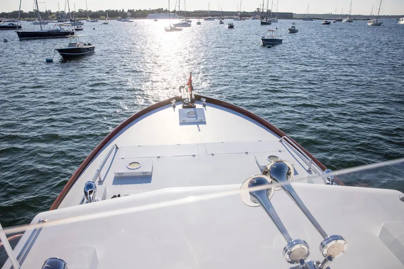 Slide: The Image of Bow view of 1964 Huckins Out Islander 56 yacht on a sunny day at sea. - 7
