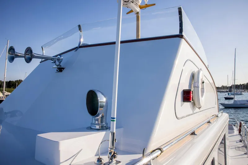 Slide: The Image of 1964 Huckins Out Islander 56 yacht, featuring sleek design and nautical equipment. - 9