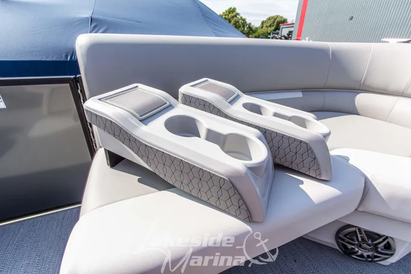 Slide: The Image of 2026 Godfrey Sweetwater 2286 SFLX boat interior with cup holders and seating. - 13
