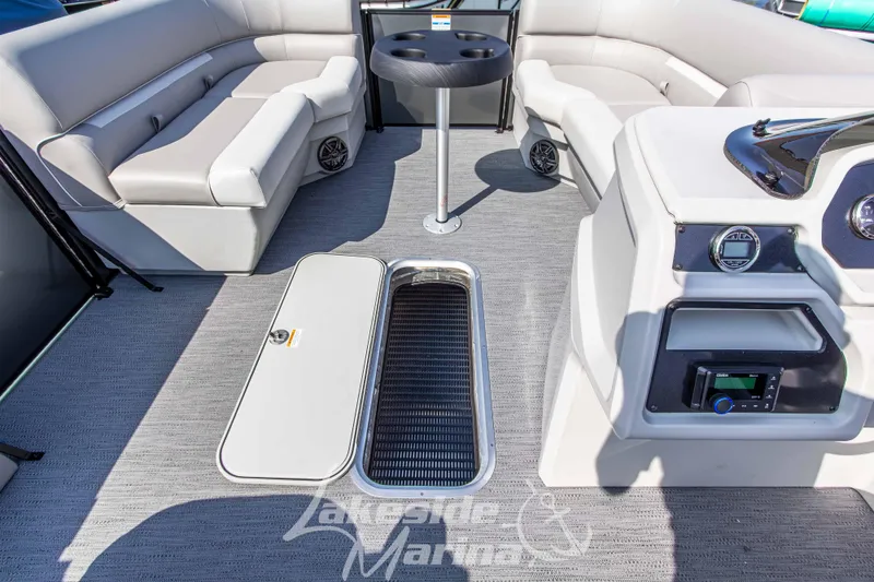 Slide: The Image of 2026 Godfrey Sweetwater 2286 SFLX boat interior with seating and storage compartments. - 17