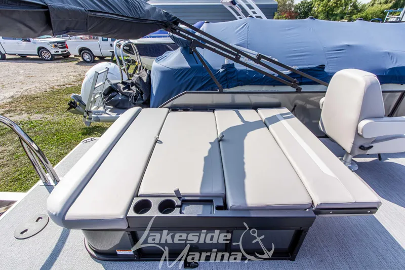 Slide: The Image of 2026 Godfrey Sweetwater 2286 SFLX boat with cushioned seating at Lakeside Marina. - 29