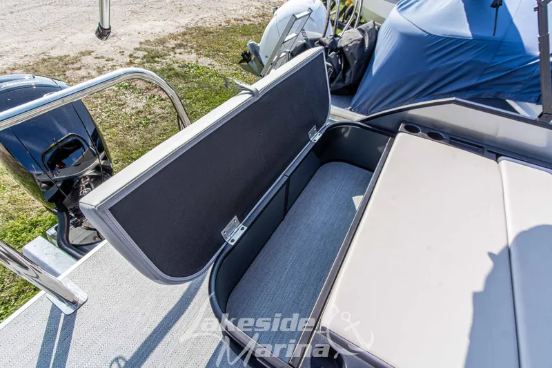 Slide: The Image of 2026 Godfrey Sweetwater 2286 SFLX boat with open storage compartment and seating. - 32