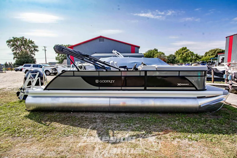 Slide: The Image of 2026 Godfrey Sweetwater 2286 SFLX pontoon boat displayed outdoors. - 4