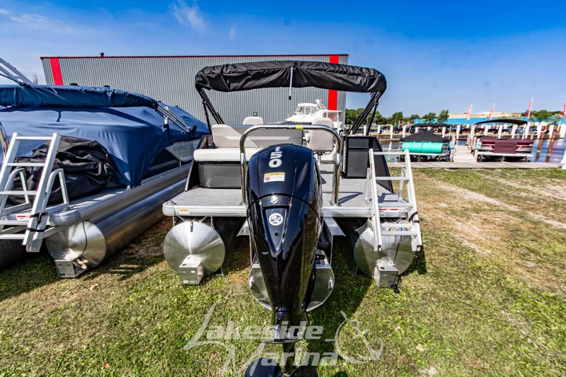 Slide: The Image of 2026 Godfrey Sweetwater 2286 SFLX pontoon boat at Lakeside Marina, rear view. - 7
