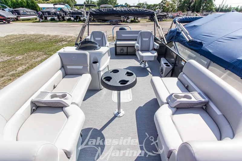 Slide: The Image of 2026 Godfrey Sweetwater 2286 SFLX pontoon boat interior with seating and table. - 9