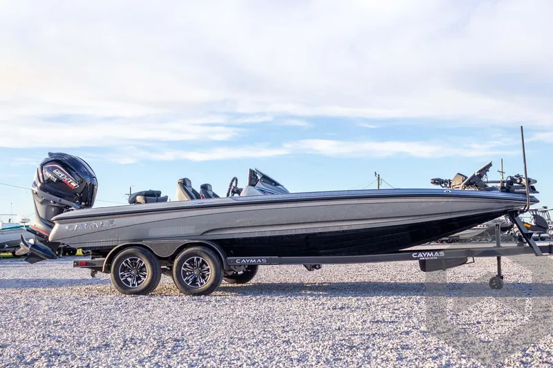 Slide: The Image of 2026 Caymas CX 21 PRO boat on trailer, side view, outdoors. - 12