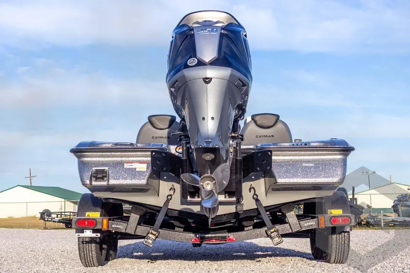 Slide: The Image of 2026 Caymas CX 21 PRO boat rear view with powerful outboard motor. - 14