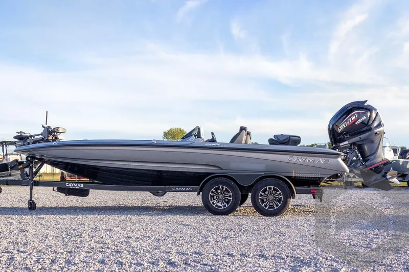 Slide: The Image of 2026 Caymas CX 21 PRO boat on trailer, side view, clear sky background. - 16