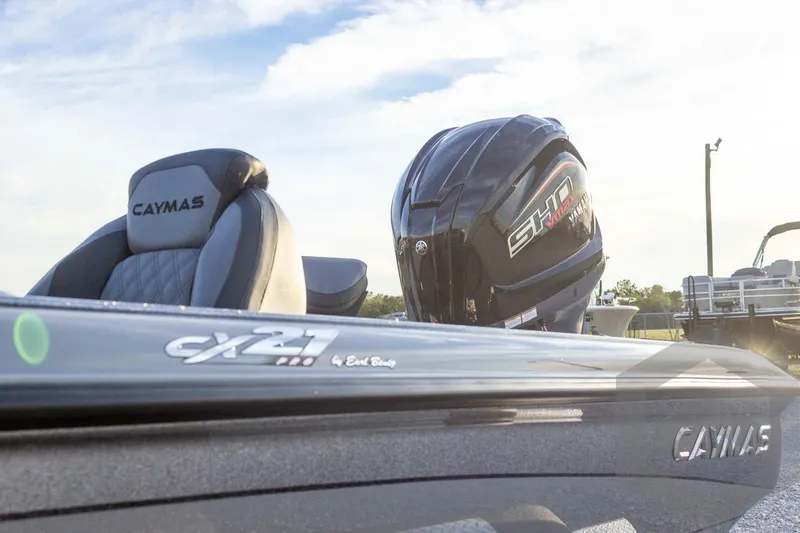 Slide: The Image of 2026 Caymas CX 21 PRO boat with Yamaha engine, featuring sleek design and comfortable seating. - 21