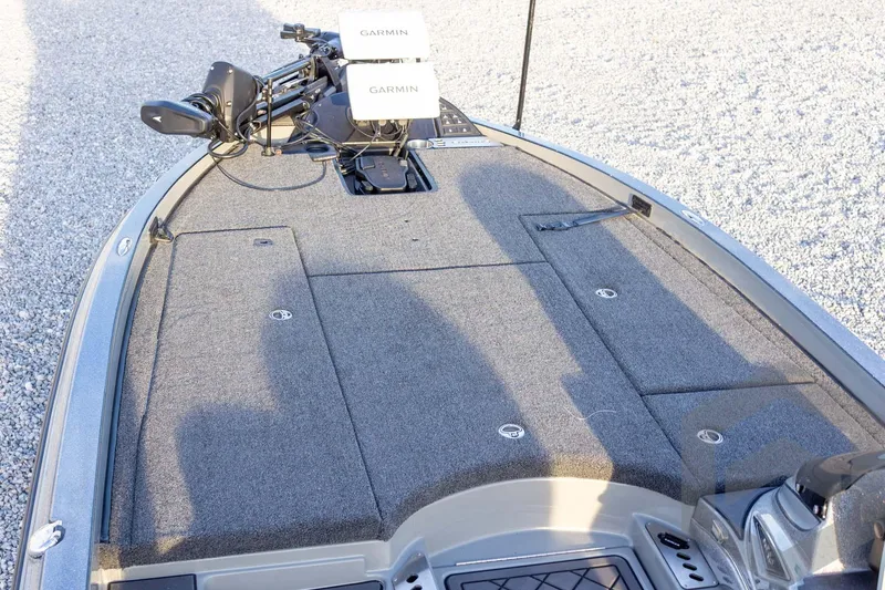 Slide: The Image of 2026 Caymas CX 21 PRO boat deck with Garmin electronics and carpeted surface. - 27
