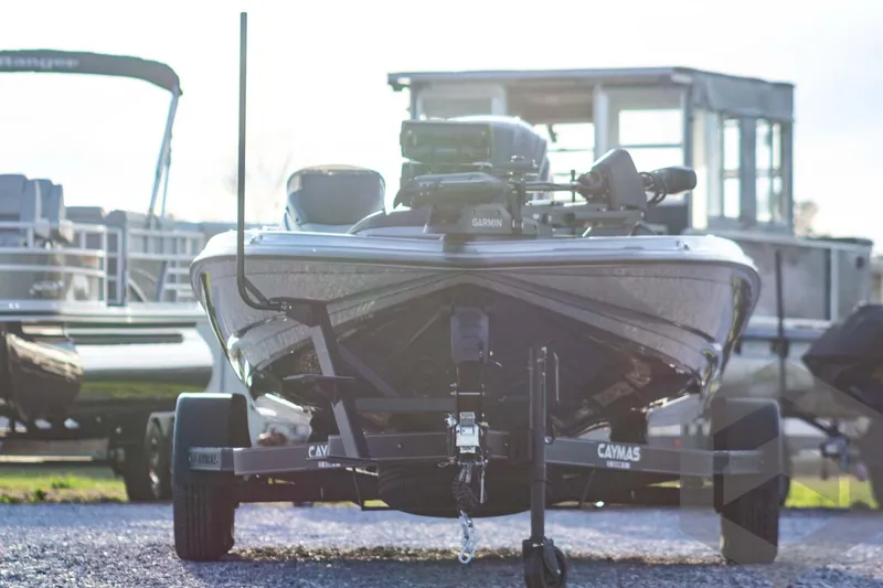 Slide: The Image of 2026 Caymas CX 21 PRO boat on trailer, parked outdoors, front view. - 3