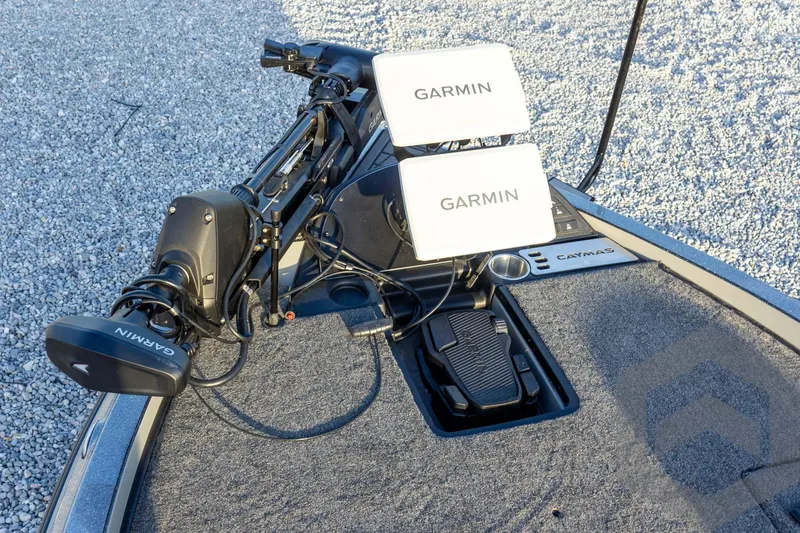 Slide: The Image of 2026 Caymas CX 21 PRO boat with Garmin electronics and trolling motor on deck. - 31