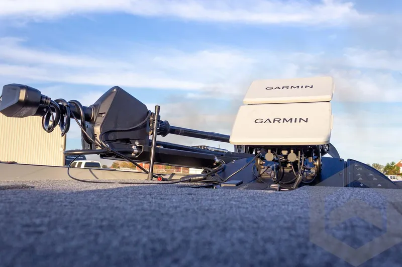 Slide: The Image of 2026 Caymas CX 21 PRO boat with Garmin electronics on deck under blue sky. - 32