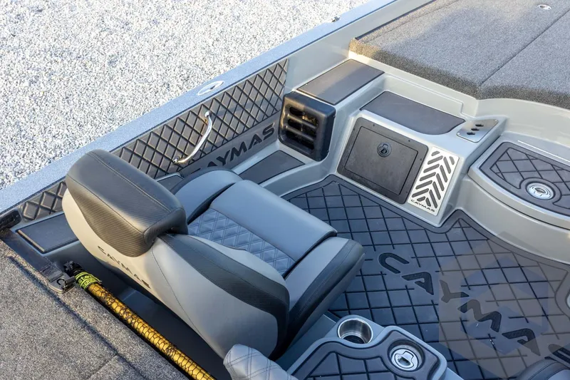 Slide: The Image of 2026 Caymas CX 21 PRO boat interior with sleek seating and storage compartments. - 37