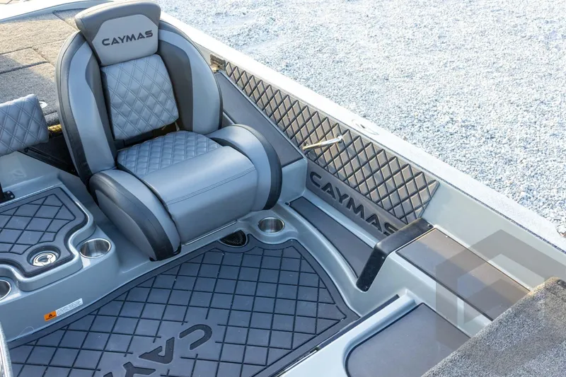 Slide: The Image of 2026 Caymas CX 21 PRO boat interior with gray diamond-stitched seating and branded flooring. - 38